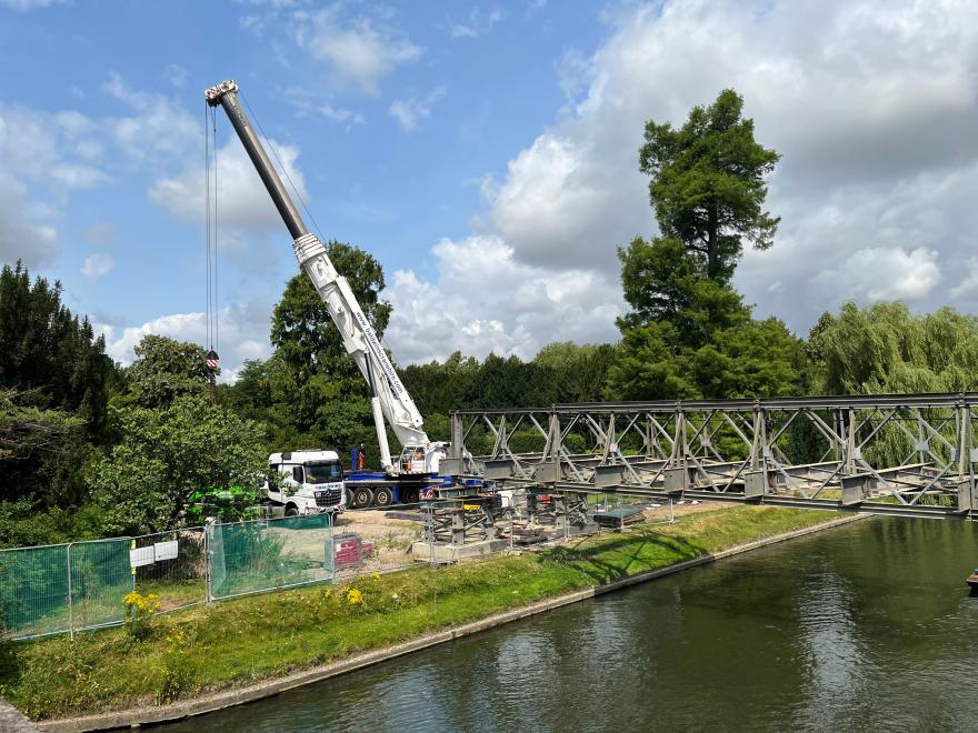 Crane removing temporary bridge