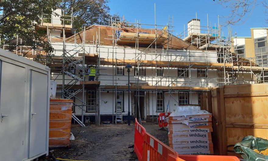 Braeside with scaffolding during install of new windows and external insulation