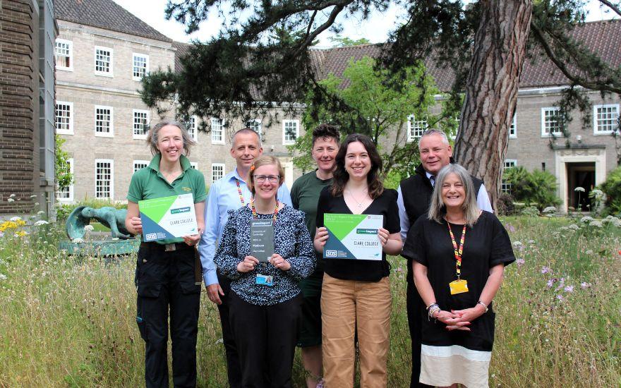 Members of Clare College staff with Green Impact Awards