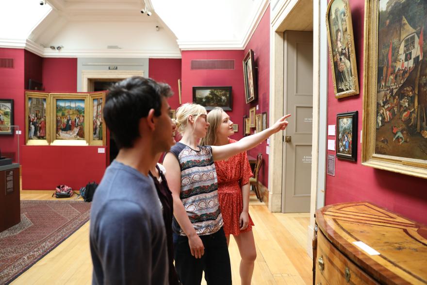 Students pointing at art in the Fitzwilliam Museum